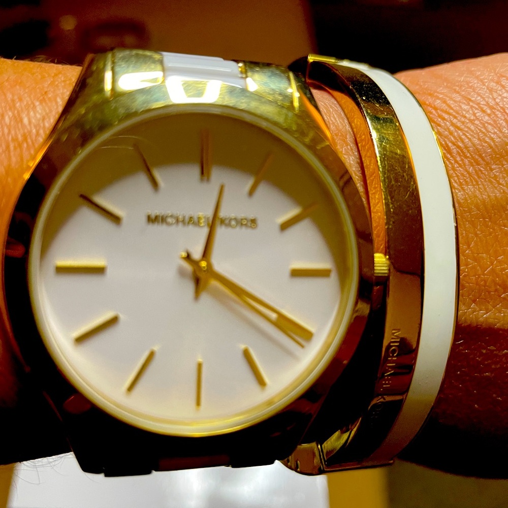 Michael Kors white and gold watch and bracelet.